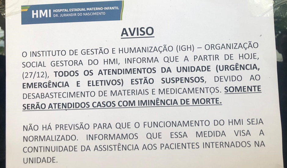 Comunicado na porta do Hospital Materno Infantil orienta pacientes a buscar outras unidades (Foto: Reprodução)