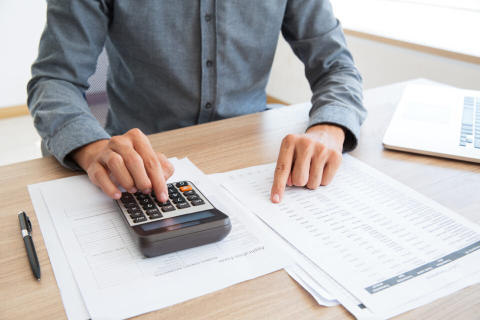 Unrecognizable man working with financial data