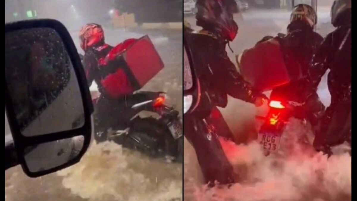 Policiais alvam motoqueiros ilhados pela enxurrada