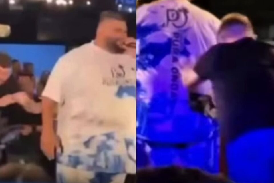 Paulão, do grupo de pagode Pura Onda, fazia show Vídeo: cantor é empurrado brutalmente do palco e caso vai parar na polícia