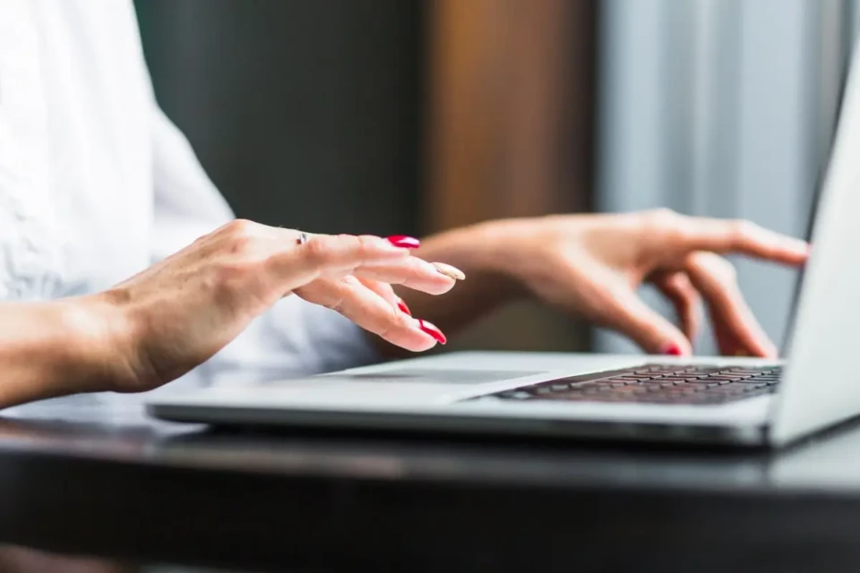 close-up-woman-s-hand-using-laptop